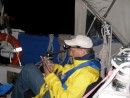 Rob reading Dickens at sea, at night
